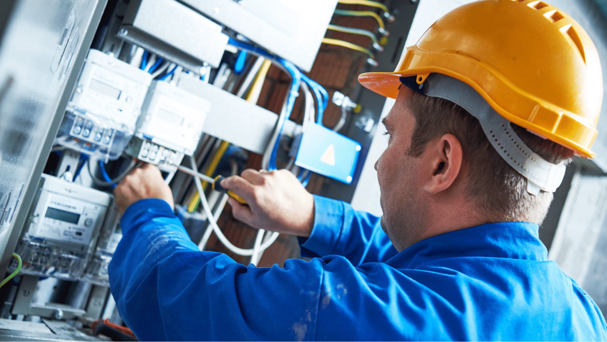 man working on an electrical panel